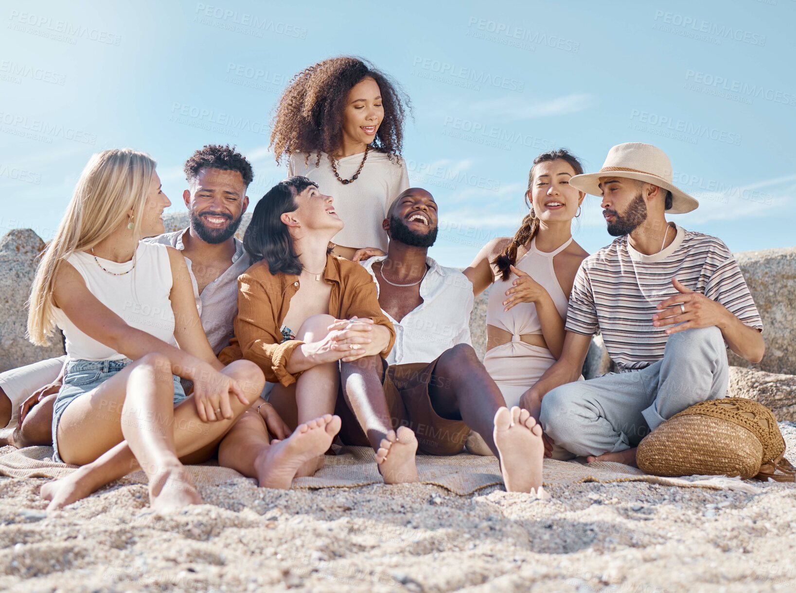 Buy stock photo Laughing, conversation and friends at beach for social get together, reunion or bonding for travel. Men, women and happiness on shore with diversity, community and funny talk with hangout at coast