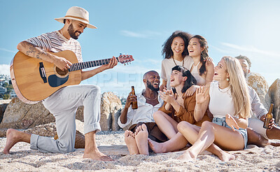 Buy stock photo Reunion, guitar or friends at beach with beer, bonding or fun entertainment on weekend break. Happy, drinks or people with music instrument, playing song or group connection in outdoor getaway.