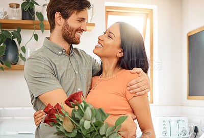 Buy stock photo Smile, couple and hug with flowers in home for love, partner appreciation and anniversary gift. Happy, people and roses with embrace for affection, gratitude and romantic present on special occasion