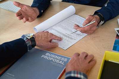 Buy stock photo Hands, documents and signature with business proposal for review, contract or b2b collaboration. People, paperwork and compliance for partnership, point and explain with deal for agreement at agency