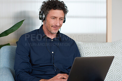 Buy stock photo Businessman, smile and headphones in office with laptop, music and software development for web design. Happy, mature person and digital designer with computer, site test and audio tech for podcast.