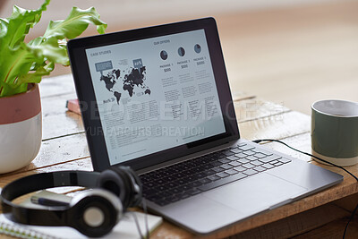 Buy stock photo Laptop screen, headphones and table with coffee in home for case study, research or information. Empty, computer or drink with notebook on desk for economic data, statistics or analytics in house