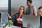 Business people using computer african american team leader woman working with colleagues in office brainstorming ideas