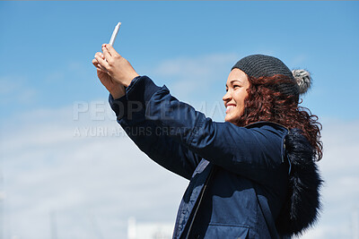Buy stock photo Woman, selfie and smile in city with winter vacation, travel and space in sky for memory on getaway. Person, happy and influencer with photography app, social media or profile picture on holiday