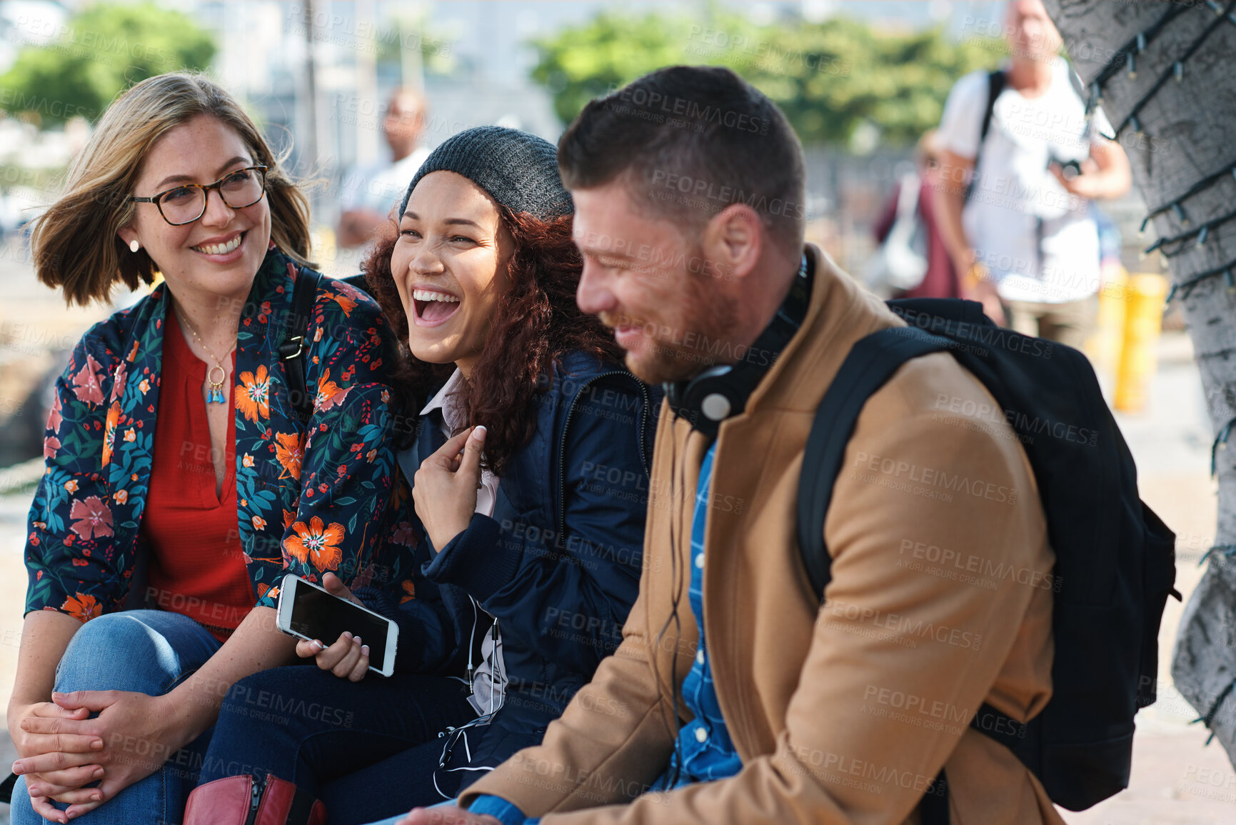 Buy stock photo Laughing, friends and people at university, education and conversation on break or hangout together. Outdoor, college students and group with humor for joke, listen and bonding with funny discussion