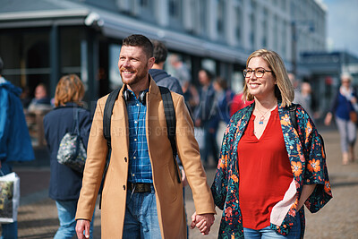 Buy stock photo Travel, holding hands and couple in city for walking to explore on holiday, vacation and trip. Marriage, happy and man with woman for bonding, relationship and tourism for adventure together in town