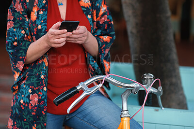 Buy stock photo Hands, bicycle and phone for texting in city for travel with search, map and eco friendly commute. Person, typing and vintage bike with mobile app in town, outdoor and sustainable transportation