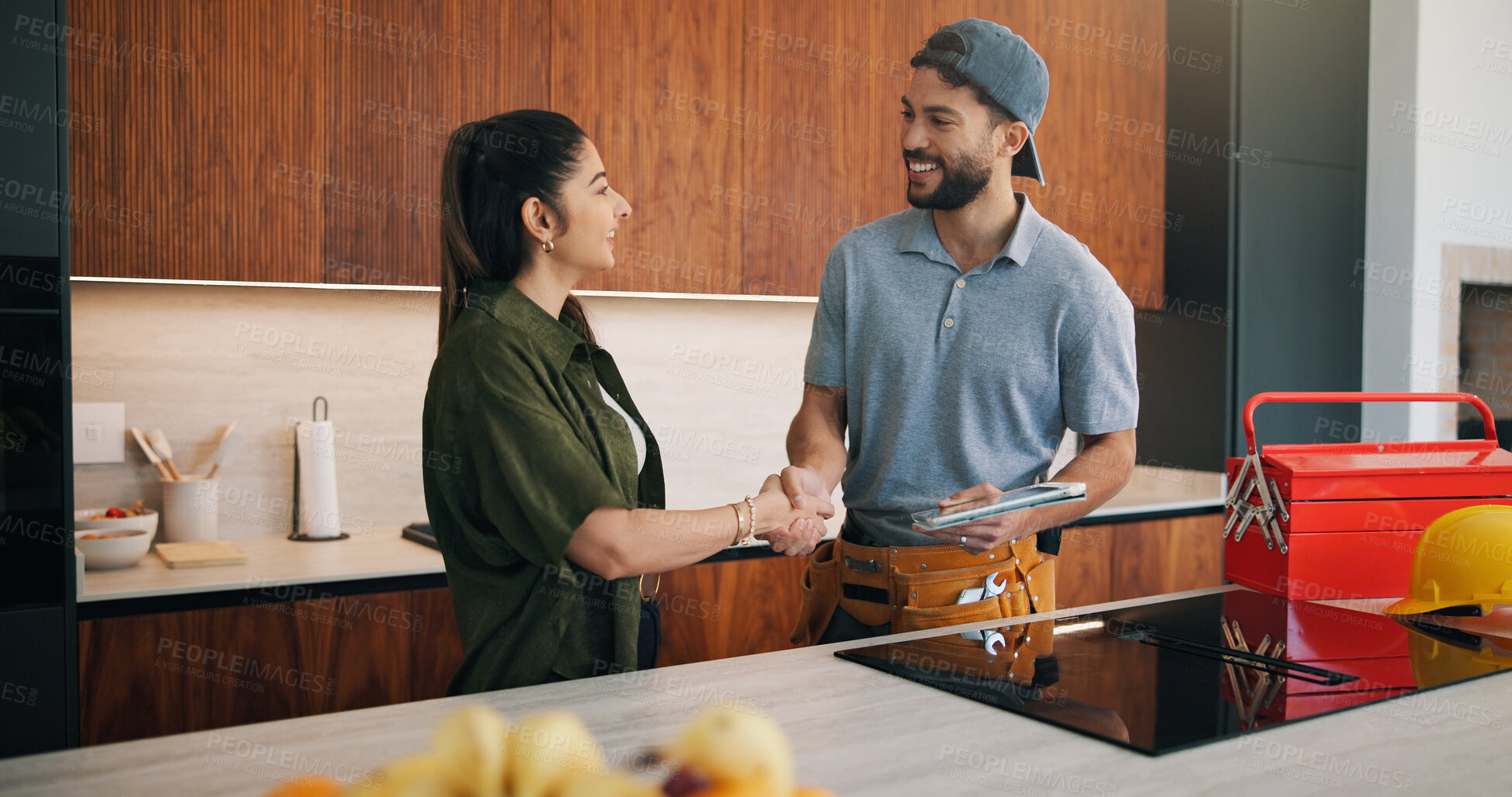 Buy stock photo Happy, woman and handshake with plumber in home for welcome, introduction and maintenance deal. Person, shaking hands and technician with tablet, thank you and pricing agreement for plumbing services