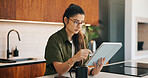 Remote work, scroll and tablet with woman n kitchen of home for online planning or research. App, coffee and reading with freelance person at counter in apartment for small business or startup agenda