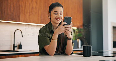 Buy stock photo Happy woman, coffee and typing with phone in kitchen for morning discussion, chat or social media. Female person, user or smile on mobile smartphone for online texting, message app or communication