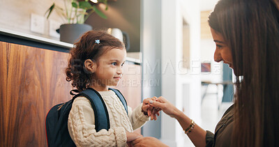 Buy stock photo Backpack, holding hands and mother with daughter in home, goodbye or leaving for school. Education, love and smile of single parent woman with girl child in apartment for safety, security or support