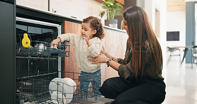 Buy stock photo Child, helping and mother with dishes in kitchen for hygiene, teaching cleanliness and guidance. Smile, woman or toddler with dishwasher for sanitation, household chores and supervision for tidy home