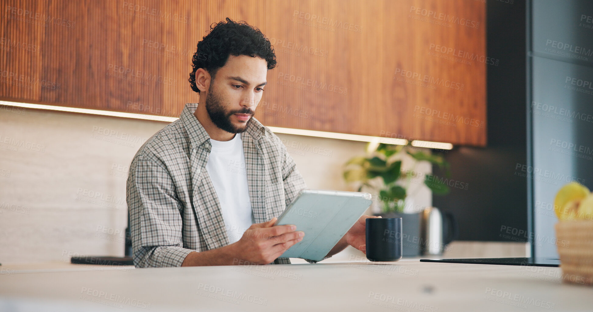 Buy stock photo Remote work, tablet or man in home with coffee, publisher communication or novel review in kitchen. WFH, tech or author with warm beverage, manuscript planning or editor feedback in story development