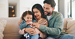 Happy family, playing and sofa with toddler in home for tickle, laughing or bonding together. Mom, dad and smile with child, daughter or kid for weekend, playful moment or childhood on couch in house
