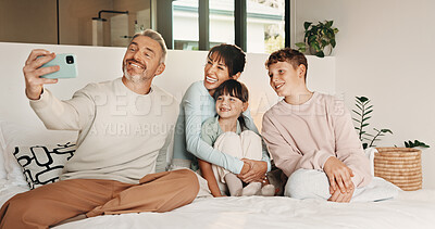 Buy stock photo Happy, family and selfie with children in bedroom, love and profile picture for social media in home. People, laughing and bonding with kids on bed, photography and memory with parents in house