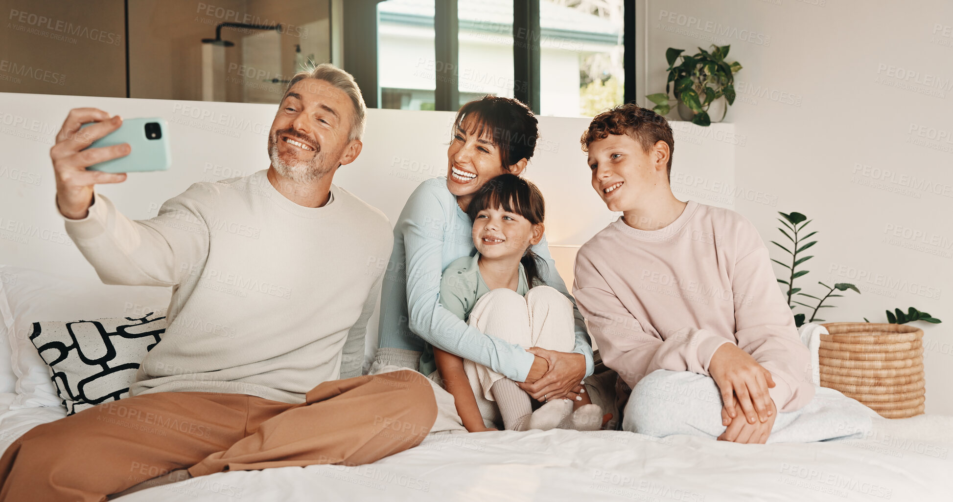 Buy stock photo Happy, family and selfie with children in bedroom, love and profile picture for social media in home. People, laughing and bonding with kids on bed, photography and memory with parents in house