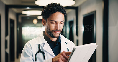 Buy stock photo Healthcare, tablet and doctor with smile in clinic for digital records, schedule or telehealth app. Physician, hospital and man with tech for scroll, planning or reading of medical results in hallway