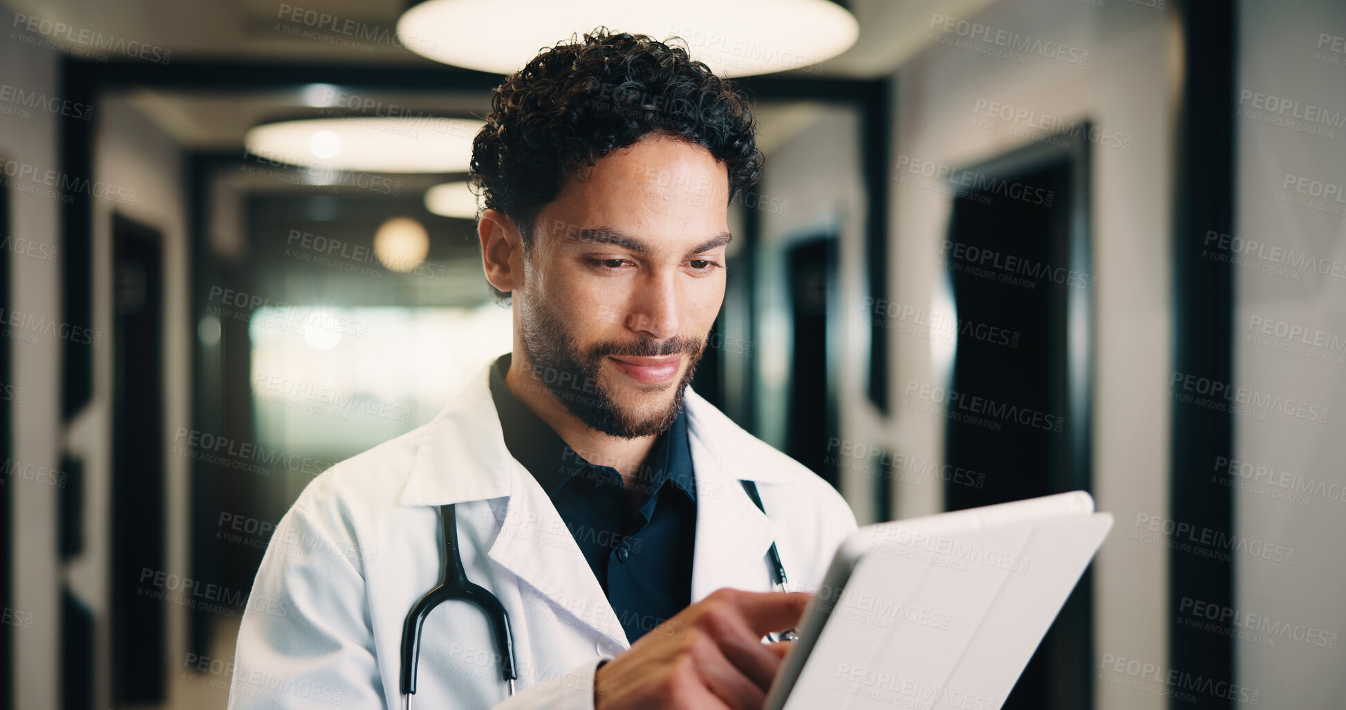 Buy stock photo Healthcare, tablet and doctor with smile in clinic for digital records, schedule or telehealth app. Physician, hospital and man with tech for scroll, planning or reading of medical results in hallway