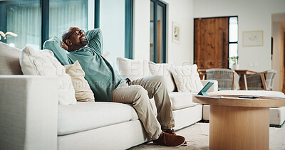 Buy stock photo Black man, happy and documents for taxes in home with relief, finished or stretching on sofa in lounge. Mature person, smile and relax with financial compliance, bills or budget review in living room