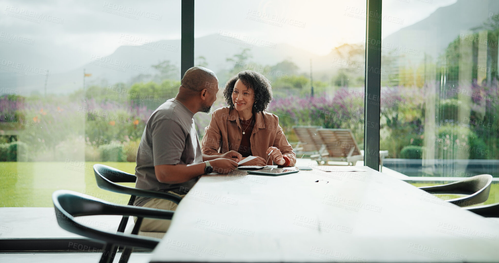 Buy stock photo Couple, documents and happy with budget in home for financial review, planning or bills by window. Mature people, paperwork and smile with investment, report or asset management with tech in house