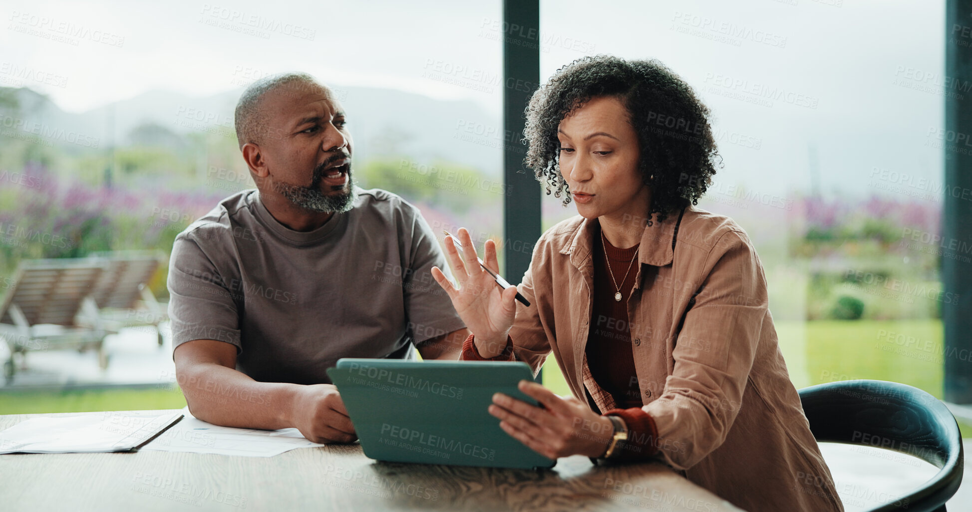 Buy stock photo Finance, argue and couple with tablet in house, savings account withdrawal and reading bank balance. Conflict, mature and African people with tech for transaction history, money dispute or debt bills