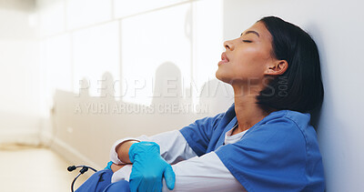 Buy stock photo Fatigue, nurse and worry with woman in hospital for medical burnout, stress and thinking. Healthcare mistake, reflection and challenge with frustrated person on floor of clinic for tired and grief
