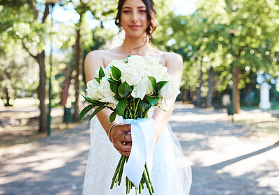 Buy stock photo Bouquet, showing and wedding with woman outdoor for marriage celebration, ceremony or event. Confidence, flowers and sunshine with portrait of bride on street in summer for matrimony or nuptials