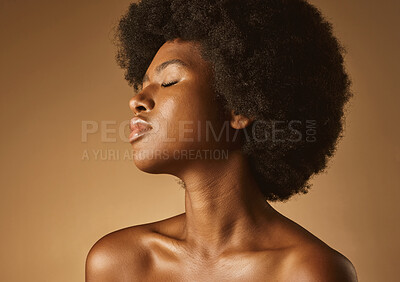 Buy stock photo Skincare, afro and natural beauty of black woman on studio background for bronze glow or shine. African person, eyes closed and cosmetics for hair, self care and wellness or aesthetic with texture