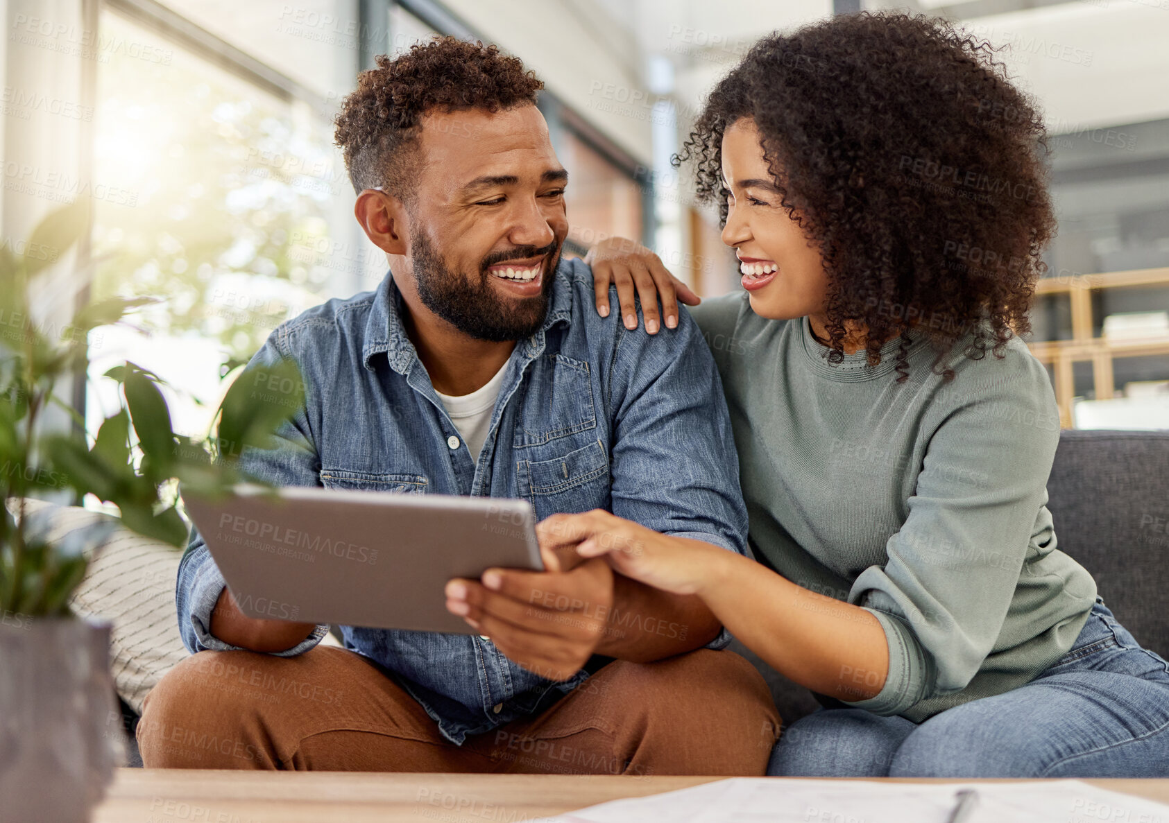 Buy stock photo Couple, relax and laughing with tablet at house for social media, browsing website and bonding. Happy, African people and digital for streaming video, comedy movies and subscription for weekend break