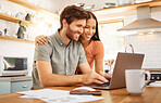 Young cheerful interracial couple bonding while working on a laptop together at home. Caucasian boyfriend and girlfriend working through their bills and using a laptop. Content wife and husband browsing online on a computer