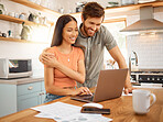 Young happy interracial couple bonding while working on a laptop together at home. Caucasian boyfriend and girlfriend planning and using a laptop. Content wife and husband browsing online on a computer