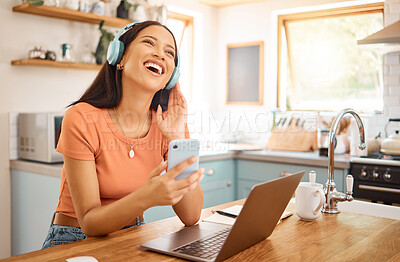 Buy stock photo Woman, laughing and headphones with phone in kitchen for music, break and funny podcast with happiness. Song, radio comedy and female person with cellphone, audio tech and subscription in home