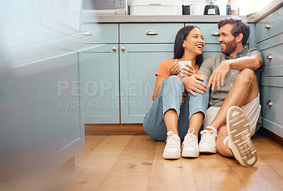 Buy stock photo Couple, laughing and relax with drink in kitchen with conversation, bonding and interracial relationship. Man, woman and talking with break together, commitment and funny story with coffee at house