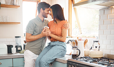 Buy stock photo Couple, happy and forehead with drink in kitchen with care, bonding and interracial relationship. Embrace, love and man with woman in commitment, trust and loyalty with coffee together at house