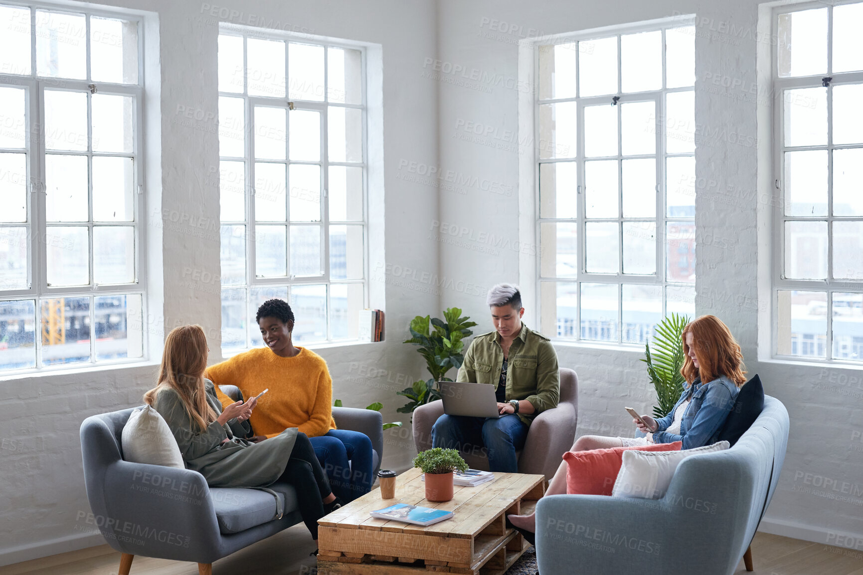 Buy stock photo Creative, coworking and people in office with tech, startup team and break room in workplace. Diversity, laptop and employees with phone, collaboration space or contemporary lounge in small business.