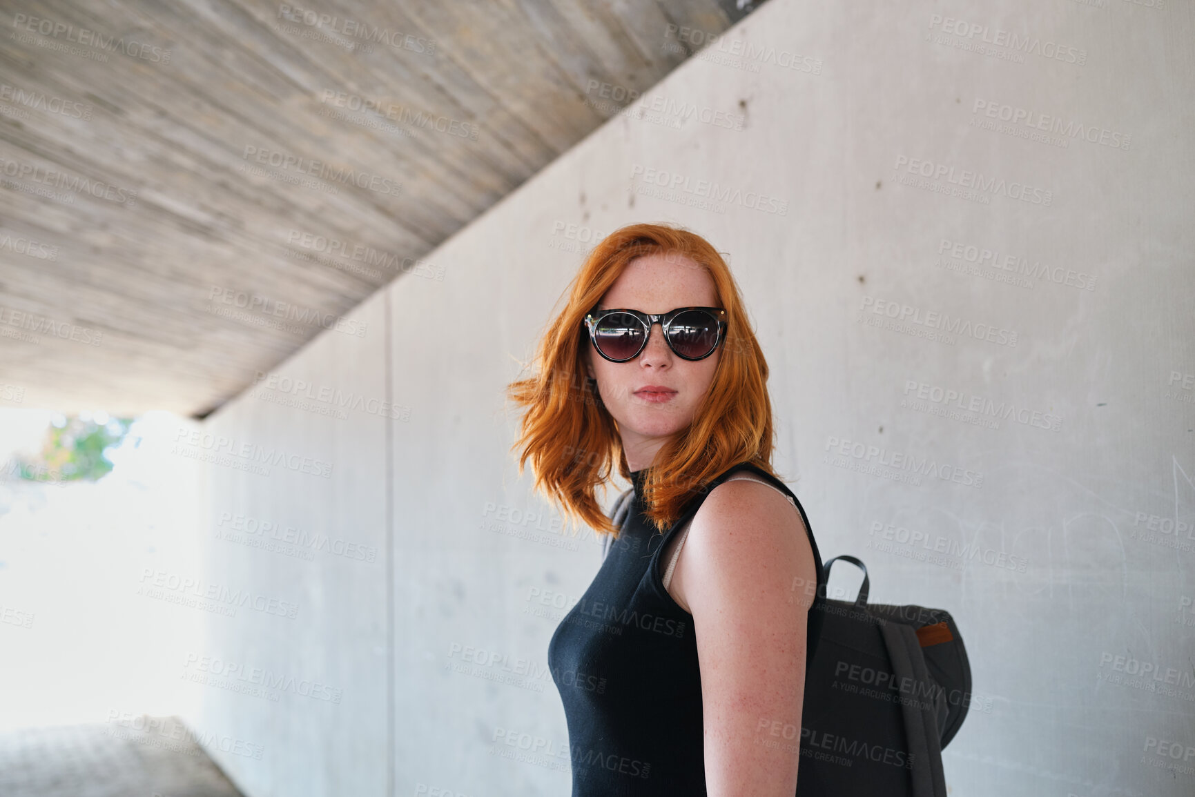 Buy stock photo Backpack, student and sunglasses with woman on campus for education at college or university. Concrete, academic and shades with person outdoor at school for development, scholarship or vision