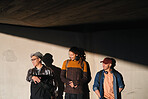 friends hanging out stylish college studetns in urban city scene at sunset