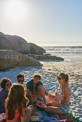 Buy stock photo Beach, picnic and friends with watermelon on holiday, travel and talking with happy people in nature. Outdoor, space and group with fruit on summer vacation, discussion and relax on sea adventure