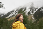 Adventure travel hiker woman exploring in beautiful green forest snow mountains on scenic outdoor tourist vacation