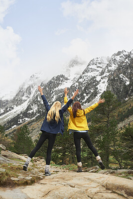 Buy stock photo Hiking, friends or celebration with mountain view outdoor for adventure achievement with goal. Freedom, back or women in nature for trekking success, arms raised or accomplishment together for travel