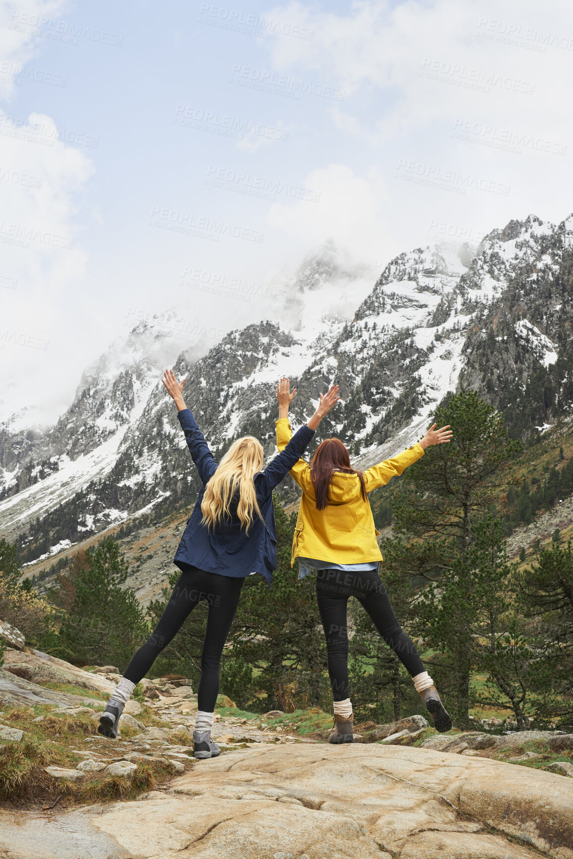 Buy stock photo Hiking, friends or celebration with mountain view outdoor for adventure achievement with goal. Freedom, back or women in nature for trekking success, arms raised or accomplishment together for travel