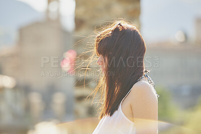 Buy stock photo Travel, thinking and woman outdoor for vacation, view and sightseeing on adventure with wind. Holiday, reflection and person in city for tourism, mindset and profile for exploration with memory