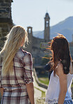 Adventure woman taking photo smart phone of rural european town travel exploration for social media