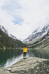 Travel adventure hiker woman on mountain lake enjoying beautiful nature landscape wanderlust