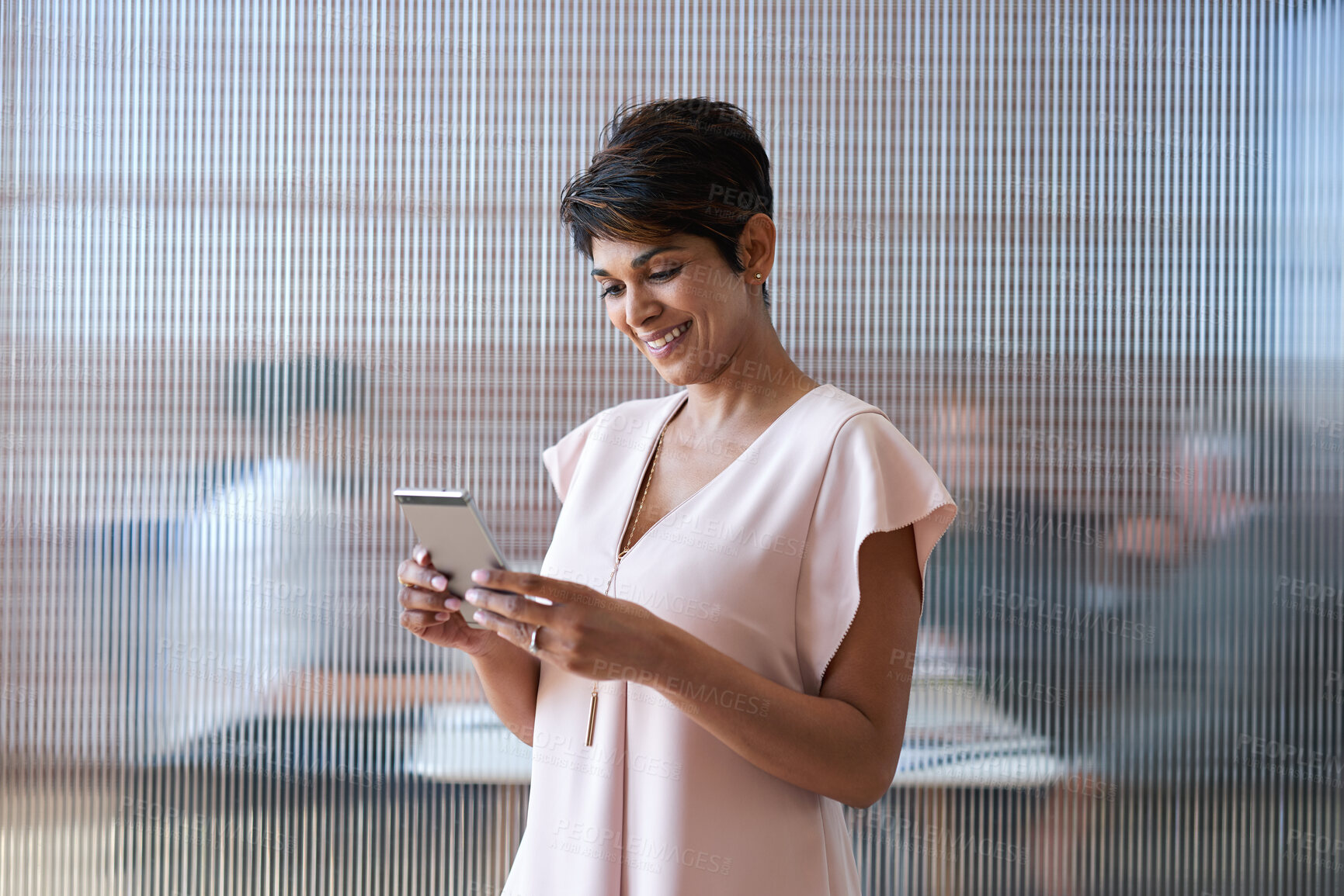 Buy stock photo Business, smile or woman in office with phone, deal close or positive feedback in online chat. Space, happy or mature property agent with tech, listing approval or good news in investment opportunity