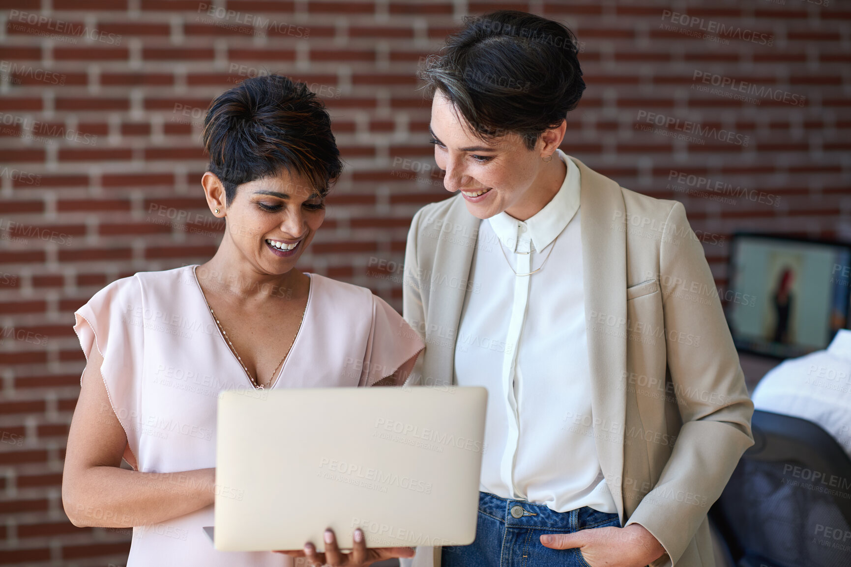 Buy stock photo Talking, office and business women on laptop for project update, proposal and financial review. Teamwork, discussion and people on computer for online report for finance, budget planning and feedback