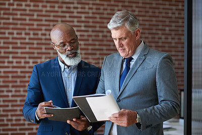 Buy stock photo Business, documents or team in office with review, budget evaluation or feedback on investment. Discussion, mature men or finance advisor with file, forecast plan or partner insight on revenue report