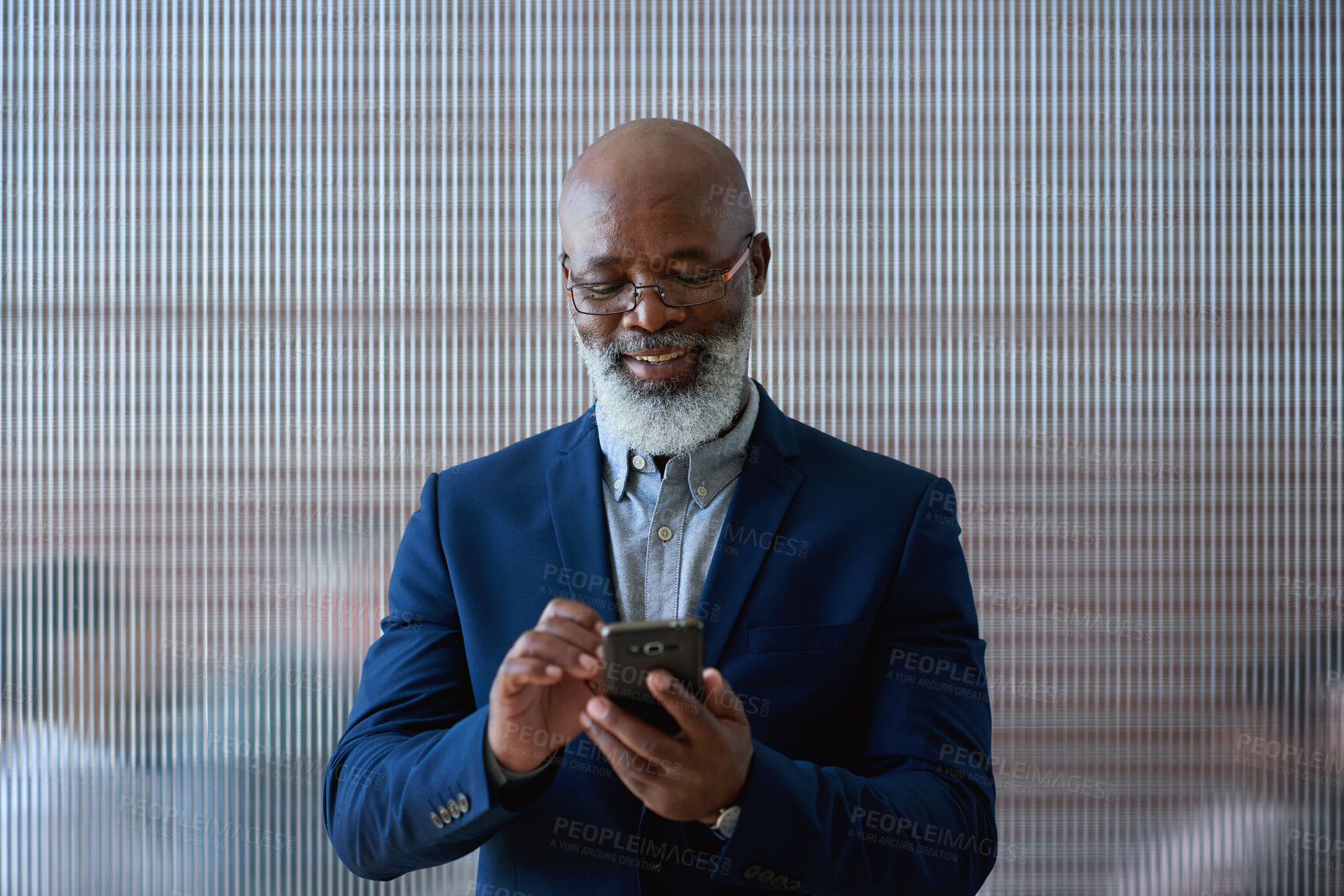 Buy stock photo Business, smile or black man in office with phone, deal close or positive feedback in email. Space, happy or mature property agent with tech, listing approval or good news in investment chat.