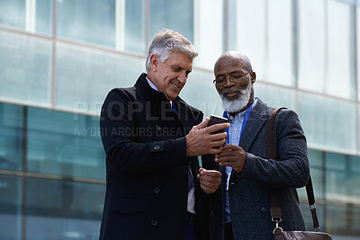 Buy stock photo Business men, mature and phone in city for online map, navigation and travel for corporate conference. People, networking or mobile app for commute route, message or notification outdoor on work trip