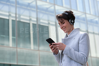Buy stock photo City, phone and business woman with music, subscription service or browsing internet on commute. Mobile, employee and person outdoor with headphones for travel podcast, audio app or smile with space